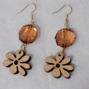 faceted gold bead and wood daisey fish hook earrings.